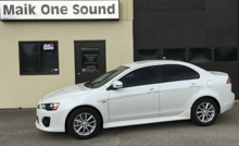 White 2017 Mitsubishi Lancer with sleek dark window tint